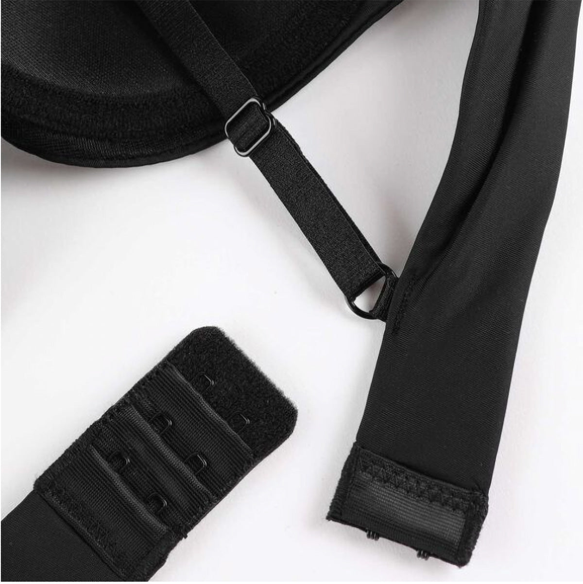 Black strap with adjustable buckle on a white background