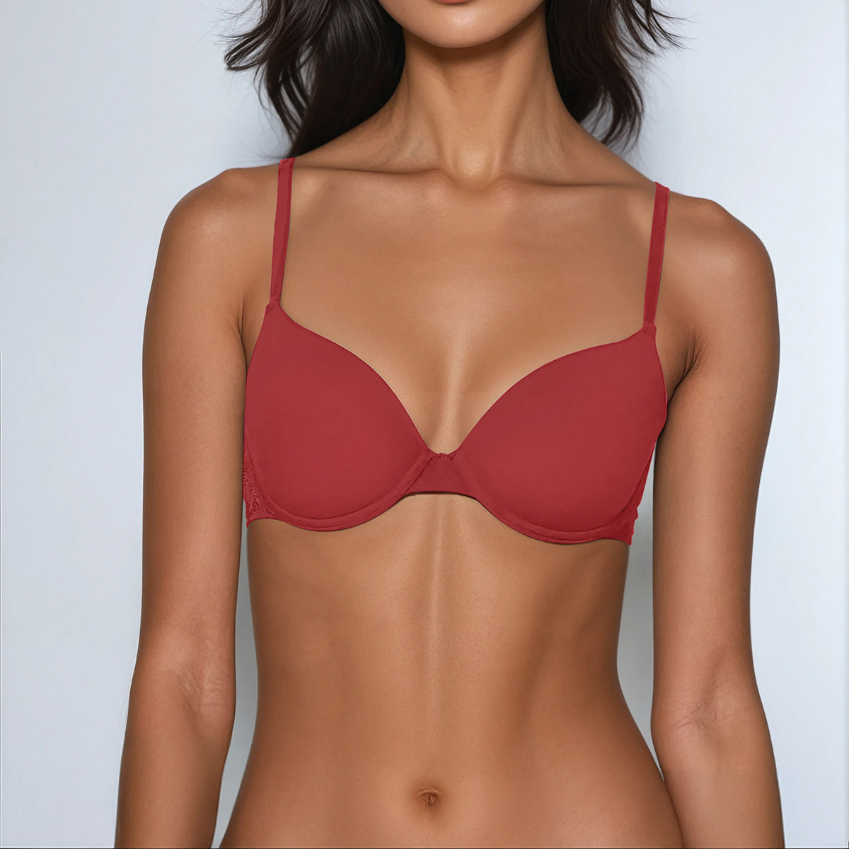 Red bra worn by a model against a plain background