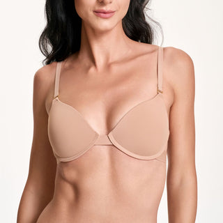 Woman wearing a beige bra on a white background