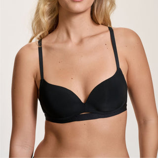 Black bra worn by a model on a plain background