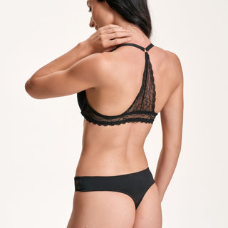 Black lace lingerie set on a plain background