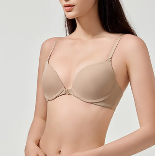 Beige bra worn by a model on a light gray background