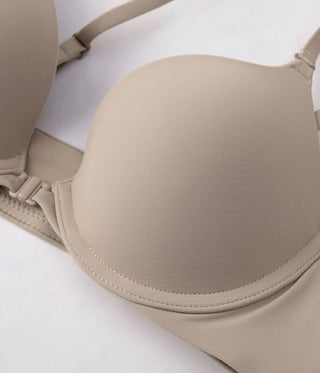 Beige bra on a white background