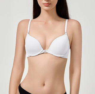White bra worn by a model on a plain background