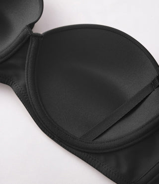 Black strapless bra on a white background