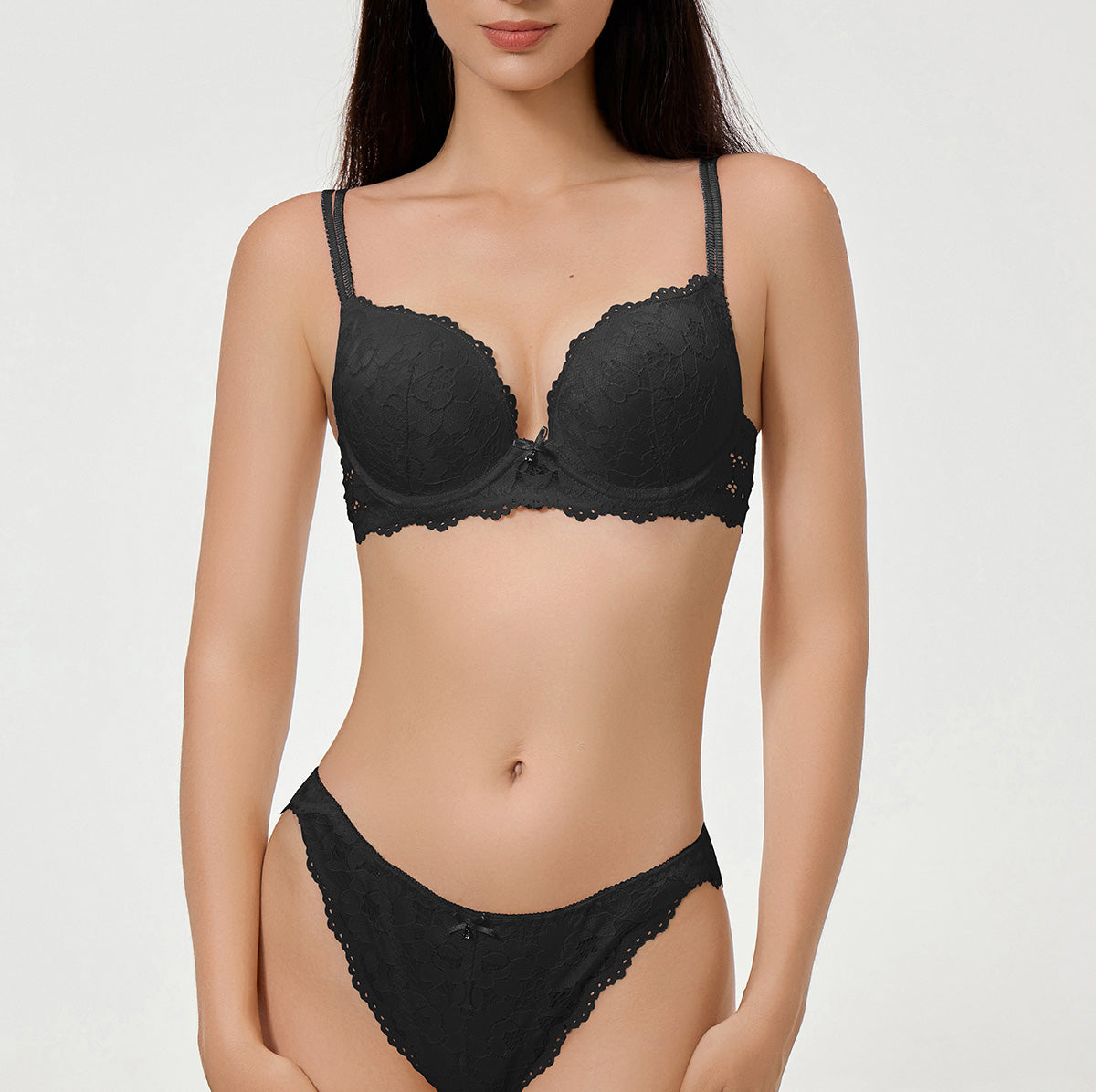 Black lace lingerie set on a plain background