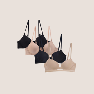 A set of four bras in beige and black colors, displayed in two pairs. The bras have a seamless design and feature a push-up and t-shirt style.