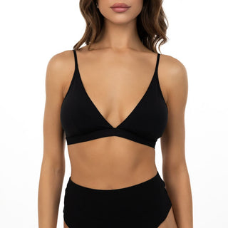 Black bikini top worn by a model on a white background